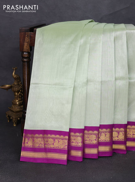 Silk cotton saree mild pista green and purple with plain body and zari woven korvai border