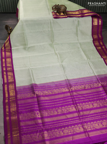 Silk cotton saree mild pista green and purple with plain body and zari woven korvai border