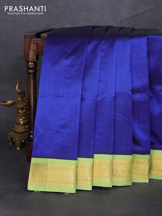 Silk cotton saree royal blue and light green with plain body and zari woven korvai border