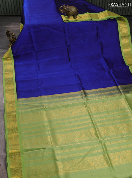 Silk cotton saree royal blue and light green with plain body and zari woven korvai border