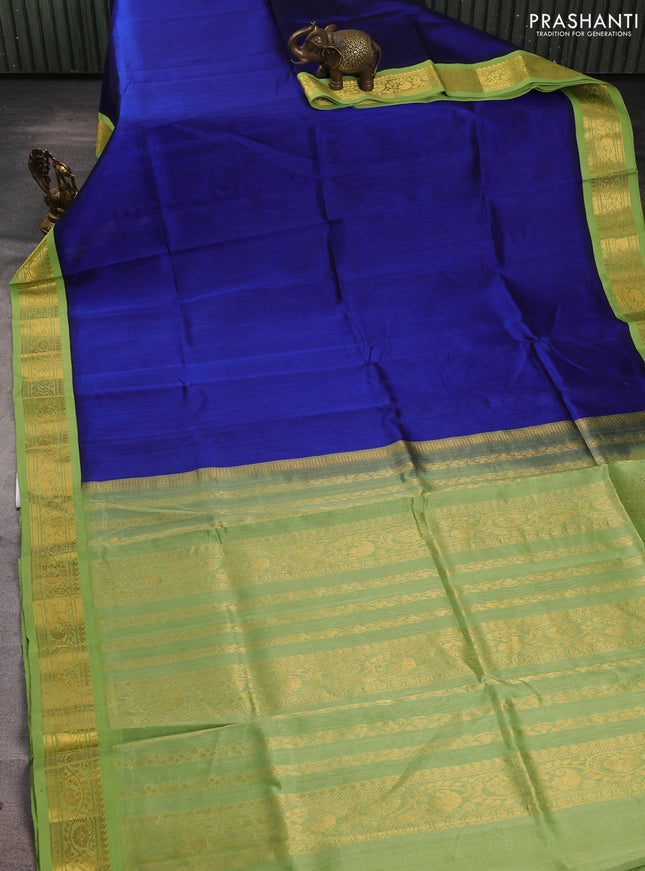 Silk cotton saree royal blue and light green with plain body and zari woven korvai border
