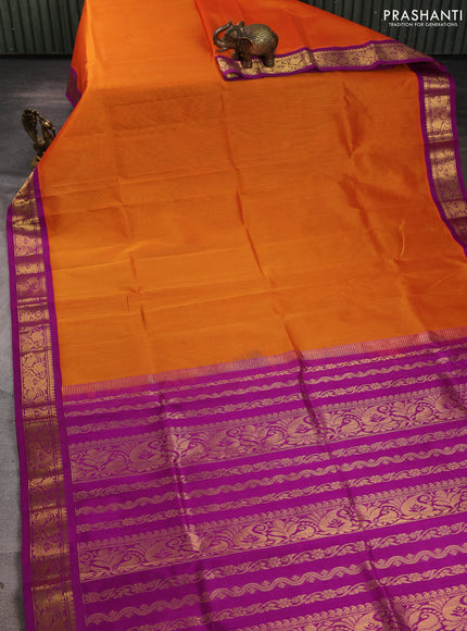 Silk cotton saree sunset orange and purple with plain body and zari woven korvai border