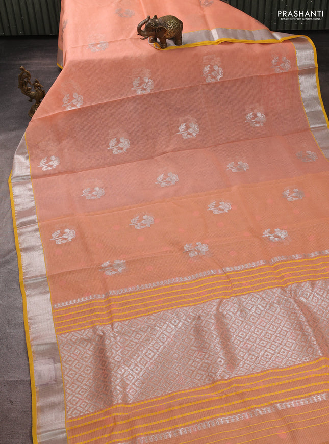 Pure zari kota silk saree peach orange and yellow with allover silver zari woven buttas and zari woven border