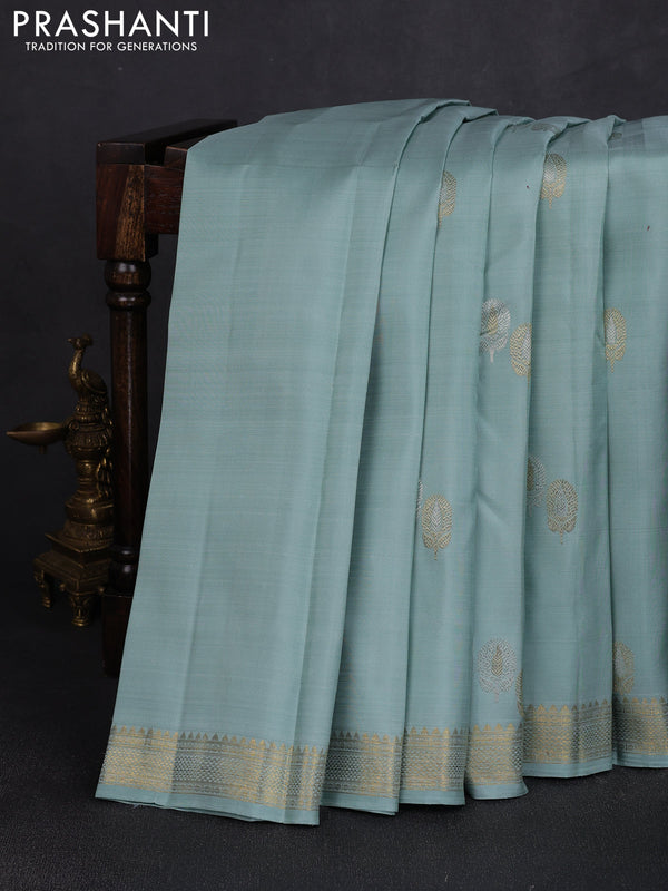 Pure kanchipuram silk saree pastel blue with plain body and temple design zari woven border