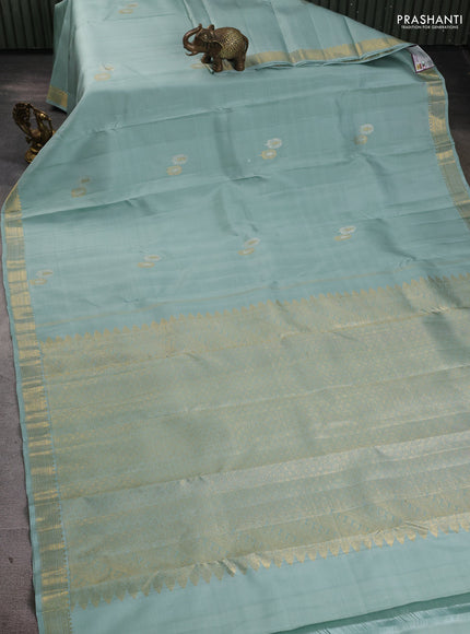 Pure kanchipuram silk saree pastel blue with plain body and temple design zari woven border