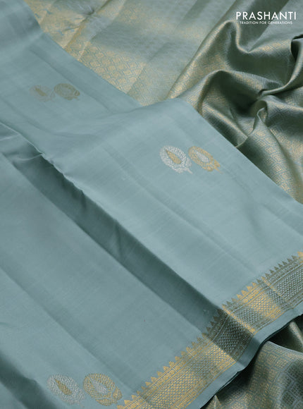Pure kanchipuram silk saree pastel blue with plain body and temple design zari woven border