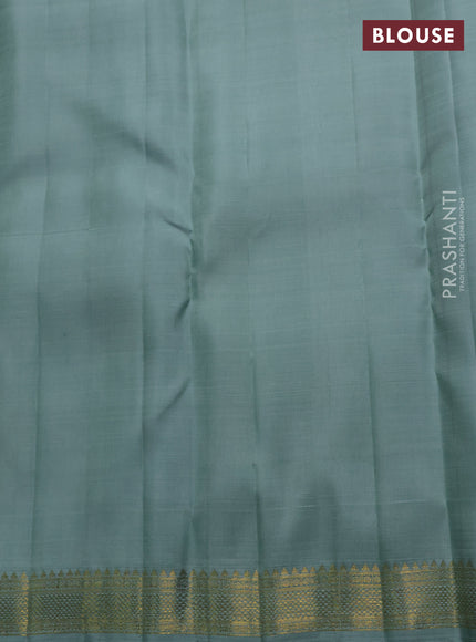 Pure kanchipuram silk saree pastel blue with plain body and temple design zari woven border