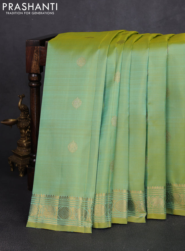 Pure kanchipuram silk saree dual shade of teal green and witrh zari woven buttas and zari woven buttas
