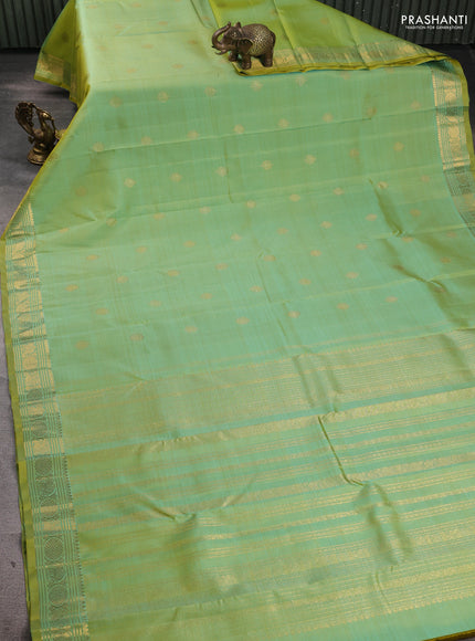Pure kanchipuram silk saree dual shade of teal green and witrh zari woven buttas and zari woven buttas
