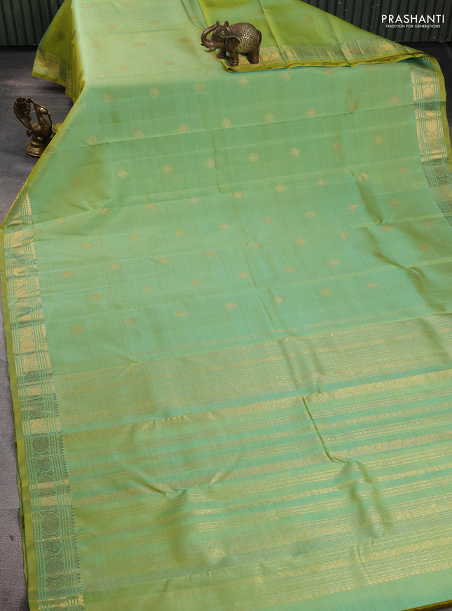 Pure kanchipuram silk saree dual shade of teal green and witrh zari woven buttas and zari woven buttas