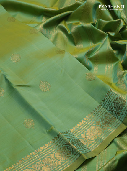 Pure kanchipuram silk saree dual shade of teal green and witrh zari woven buttas and zari woven buttas