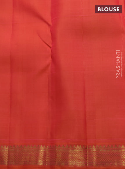Pure kanchipuram silk saree dual shade of orange with zari woven buttas and small zari woven border