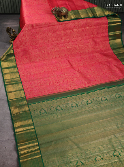 Pure kanchipuram silk saree tomato pink and green with allover zari woven brocade weaves and rich zari woven korvai border