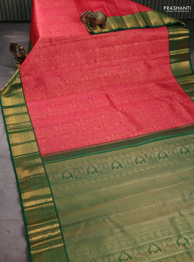 Pure kanchipuram silk saree tomato pink and green with allover zari woven brocade weaves and rich zari woven korvai border