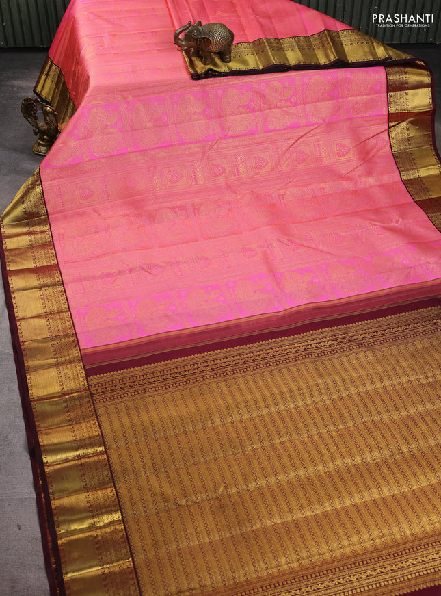 Pure kanchipuram silk saree baby pink and maroon with allover zari woven brocade weaves and zari woven korvai border