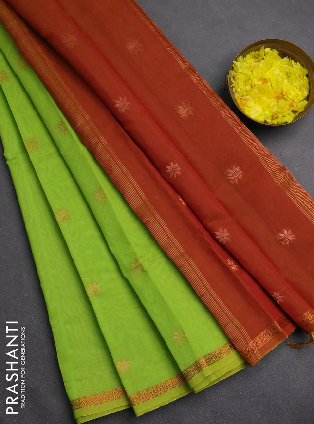 Semi maheswari cotton saree lime green and rust with copper zari woven buttas and small copper zari woven border