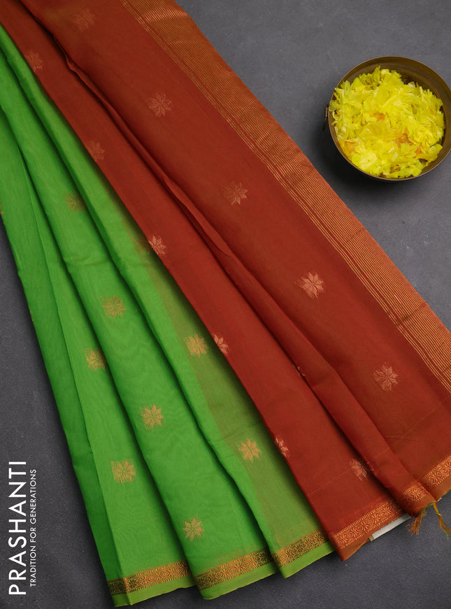 Semi maheswari cotton saree lime green and rust with copper zari woven buttas and small copper zari woven border