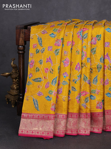 Crepe silk saree mustard yellow and pink with allover prints & pita embroidery work and zari woven border