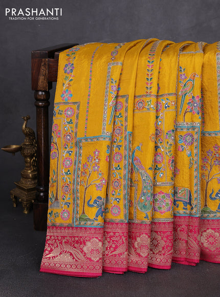 Crepe silk saree mustard yellow and pink with allover prints & pita embroidery work and zari woven border
