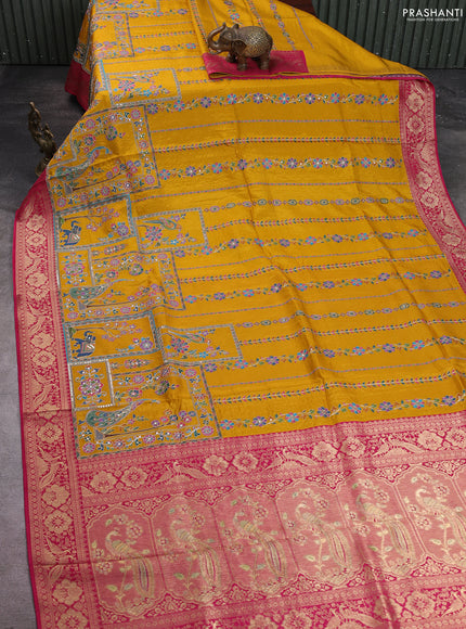 Crepe silk saree mustard yellow and pink with allover prints & pita embroidery work and zari woven border