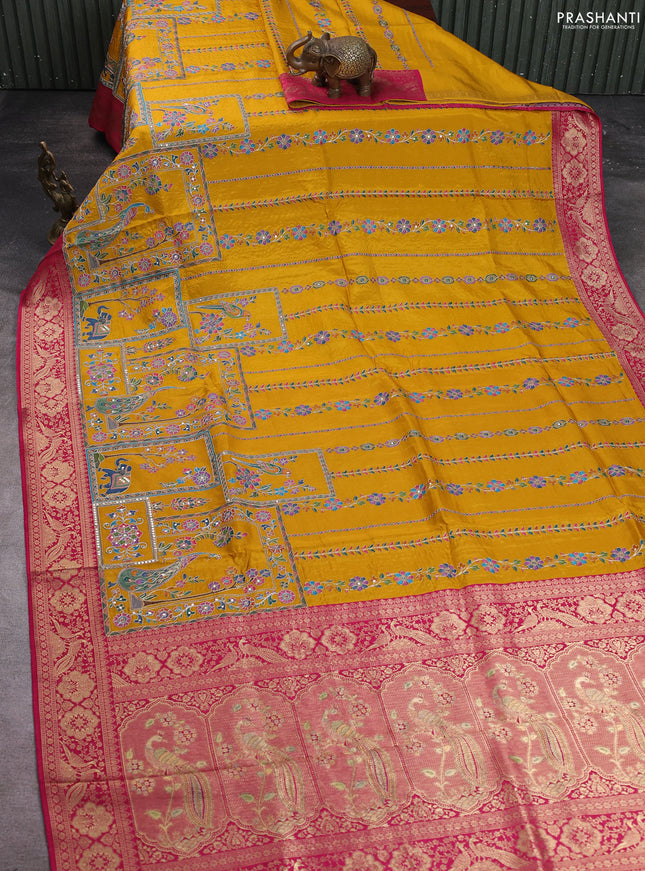 Crepe silk saree mustard yellow and pink with allover prints & pita embroidery work and zari woven border