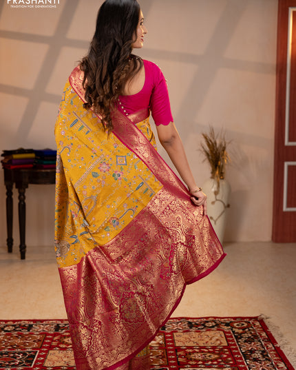 Crepe silk saree mustard yellow and pink with allover prints & pita embroidery work and zari woven border