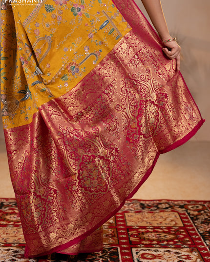 Crepe silk saree mustard yellow and pink with allover prints & pita embroidery work and zari woven border