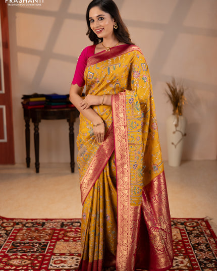 Crepe silk saree mustard yellow and pink with allover prints & pita embroidery work and zari woven border