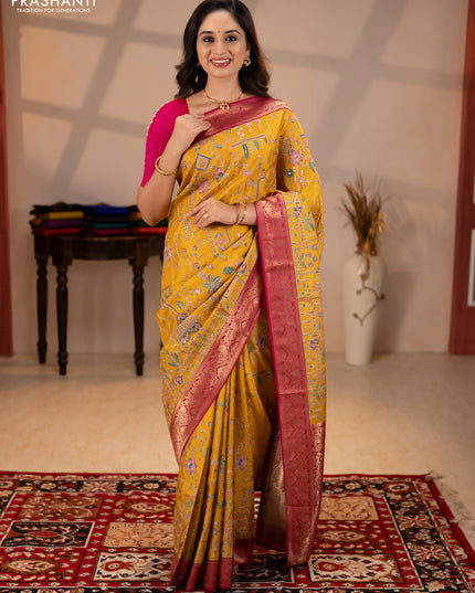 Crepe silk saree mustard yellow and pink with allover prints & pita embroidery work and zari woven border