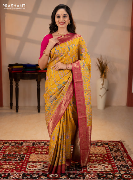 Crepe silk saree mustard yellow and pink with allover prints & pita embroidery work and zari woven border