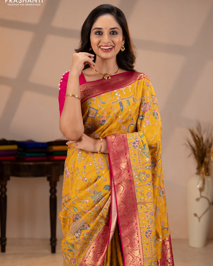 Crepe silk saree mustard yellow and pink with allover prints & pita embroidery work and zari woven border