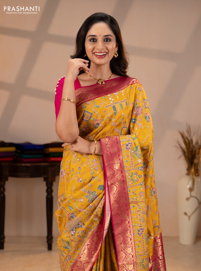 Crepe silk saree mustard yellow and pink with allover prints & pita embroidery work and zari woven border