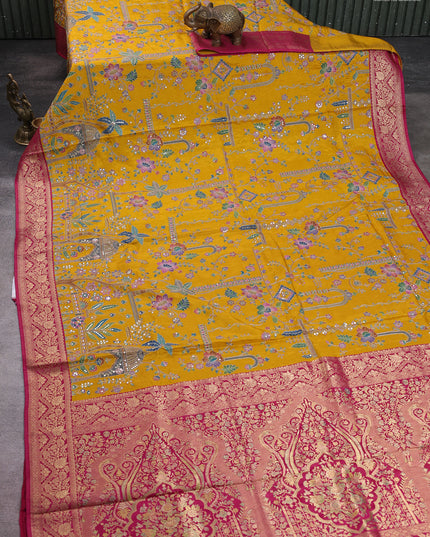 Crepe silk saree mustard yellow and pink with allover prints & pita embroidery work and zari woven border