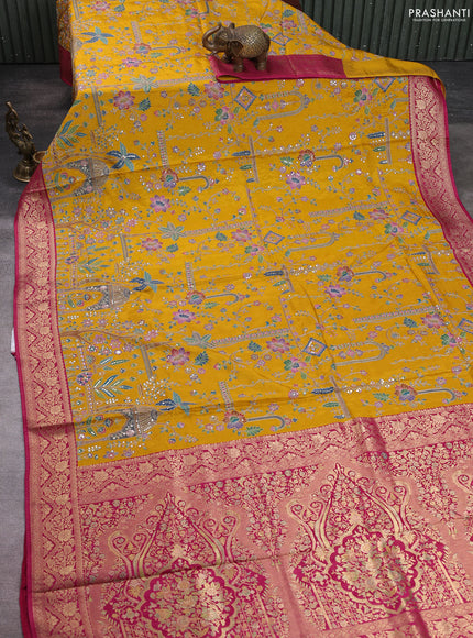 Crepe silk saree mustard yellow and pink with allover prints & pita embroidery work and zari woven border