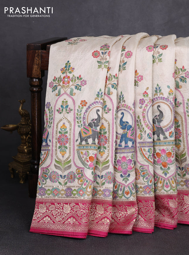 Crepe silk saree cream and dark pink with allover prints & pita embroidery work and zari woven border