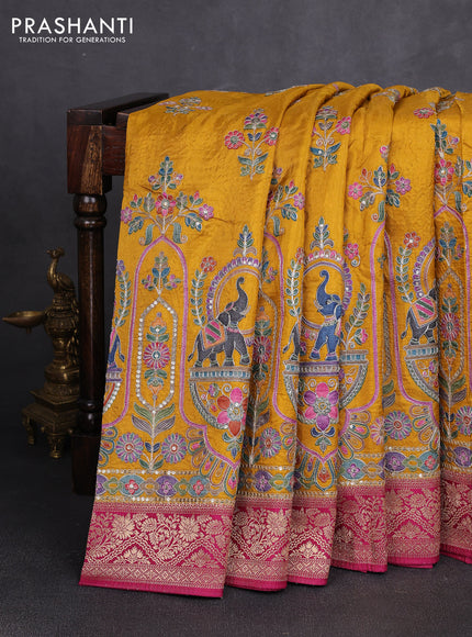 Crepe silk saree mustard yellow and dark pink with allover prints & pita embroidery work and zari woven border