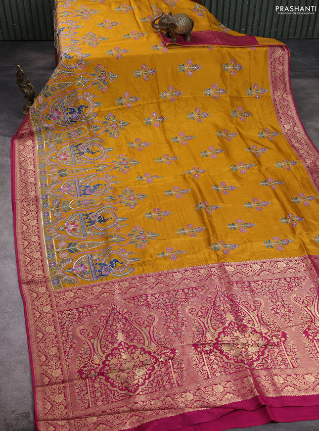 Crepe silk saree mustard yellow and dark pink with allover prints & pita embroidery work and zari woven border