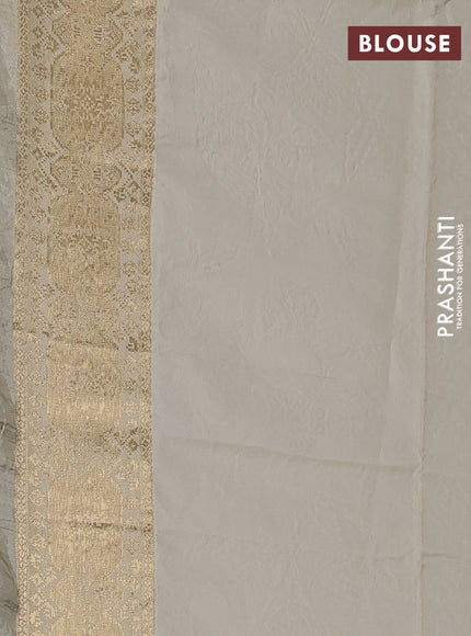 Crepe silk saree cream with allover prints & pita embroidery work and zari woven border