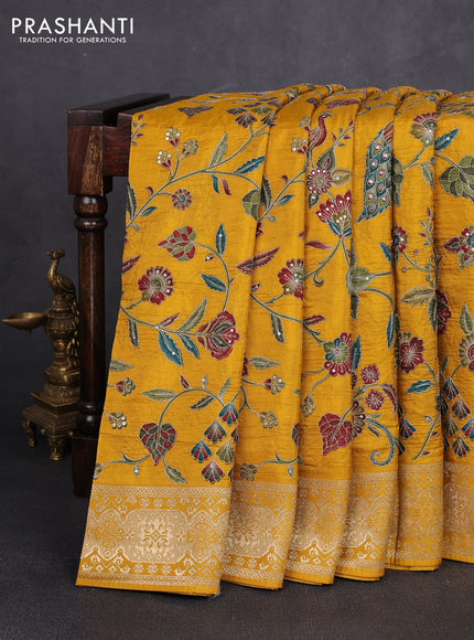 Crepe silk saree mustard yellow with allover prints & pita embroidery work and zari woven border