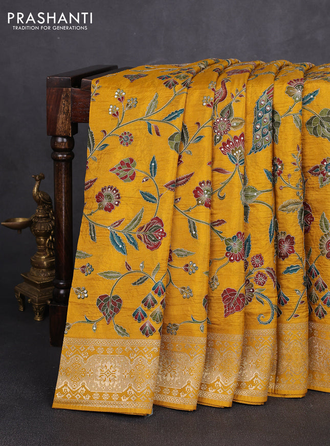 Crepe silk saree mustard yellow with allover prints & pita embroidery work and zari woven border