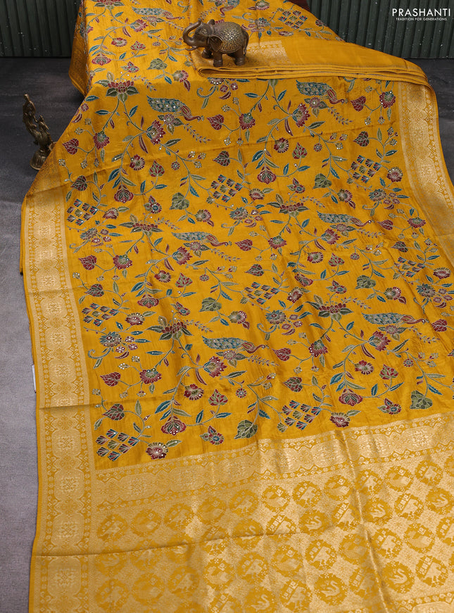 Crepe silk saree mustard yellow with allover prints & pita embroidery work and zari woven border