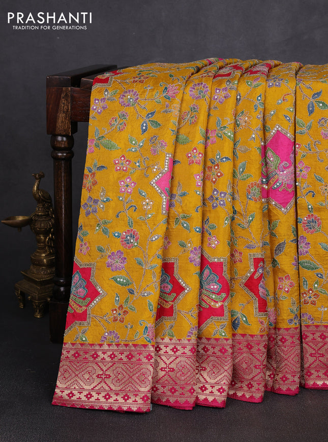 Crepe silk saree mustard yellow with allover prints & pita embroidery work and zari woven border