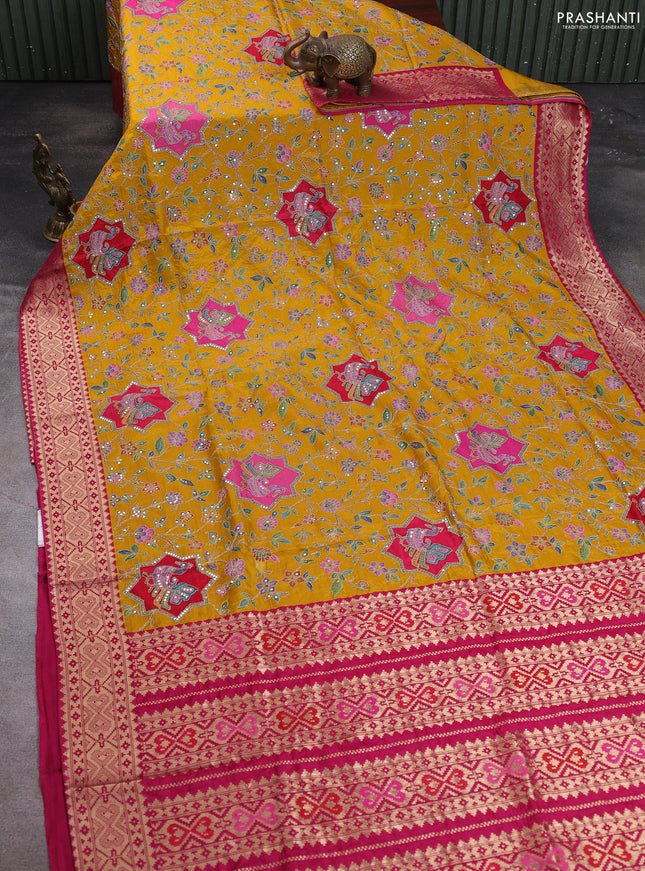Crepe silk saree mustard yellow with allover prints & pita embroidery work and zari woven border