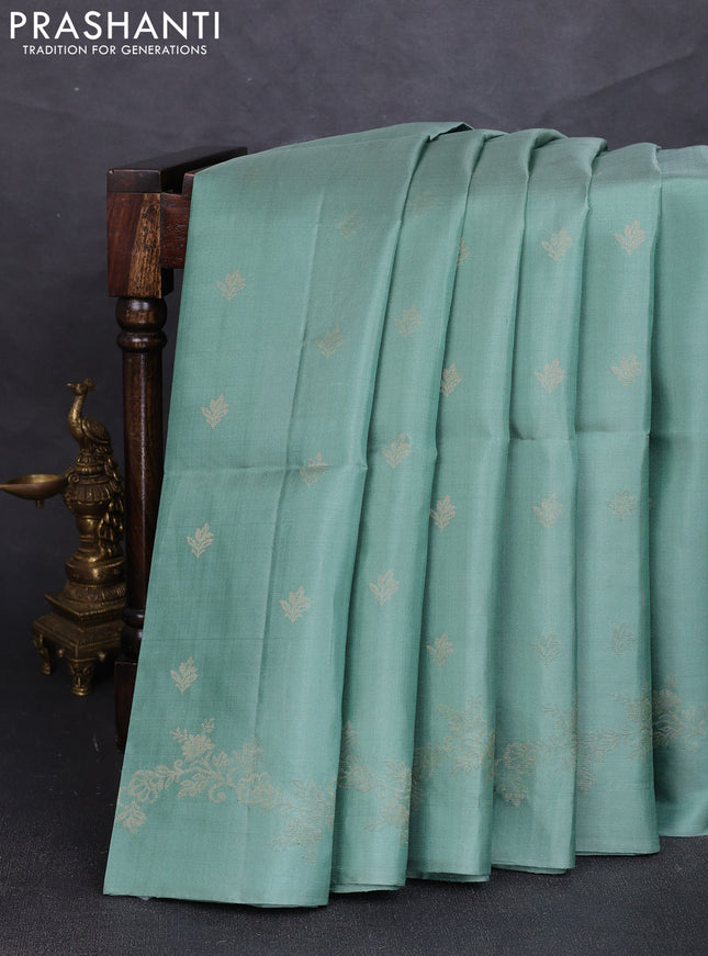 Pure soft silk saree pastel green with allover zari woven buttas and zari woven border