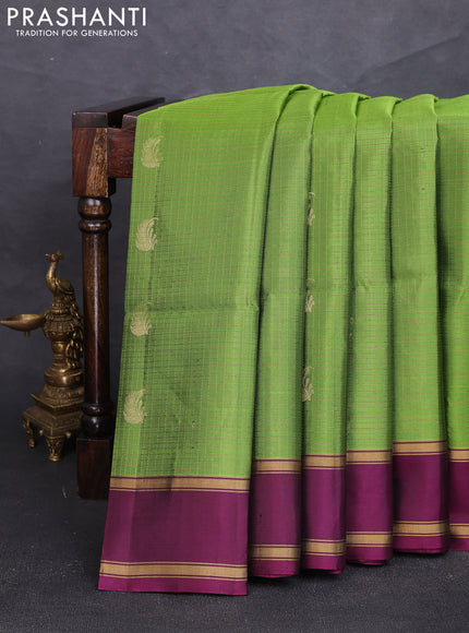 Pure soft silk saree light green and deep purple with allover small zari checks & buttas and rettapet zari woven border