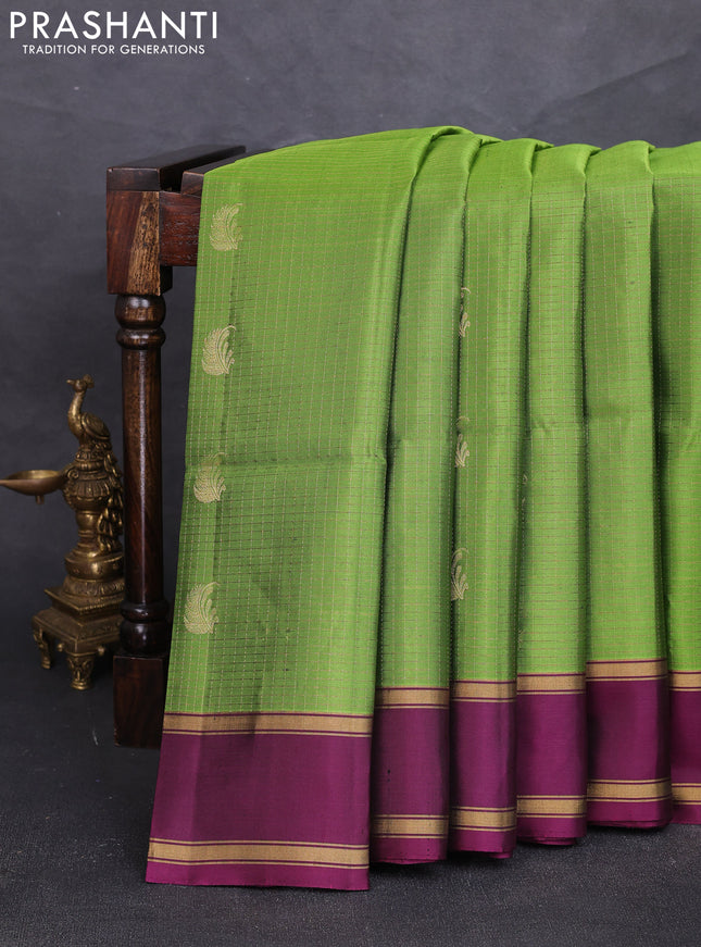 Pure soft silk saree light green and deep purple with allover small zari checks & buttas and rettapet zari woven border
