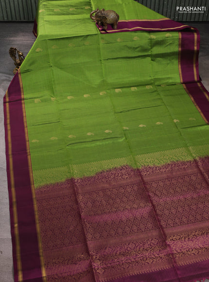 Pure soft silk saree light green and deep purple with allover small zari checks & buttas and rettapet zari woven border