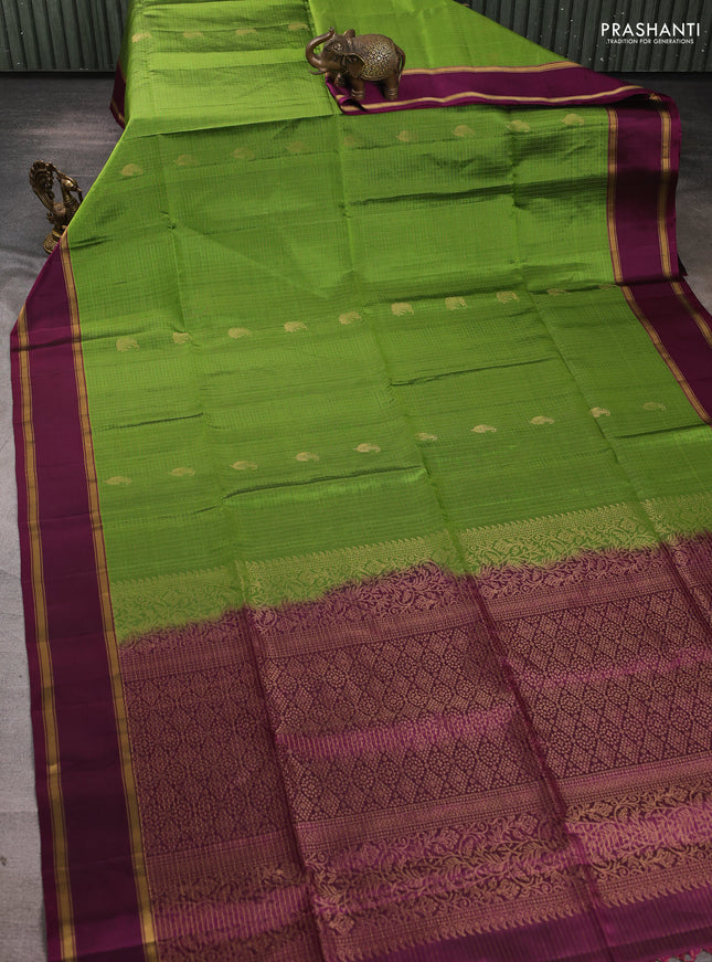 Pure soft silk saree light green and deep purple with allover small zari checks & buttas and rettapet zari woven border