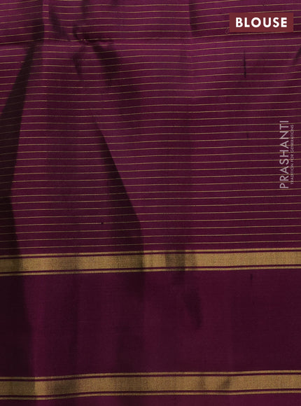 Pure soft silk saree light green and deep purple with allover small zari checks & buttas and rettapet zari woven border