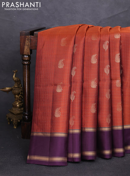 Pure soft silk saree rust shade and deep purple with allover small zari checks & buttas and rettapet zari woven border